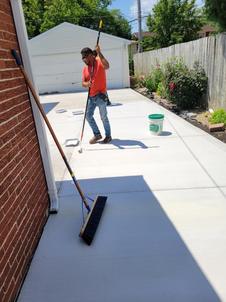 Worker finishing a concrete slab